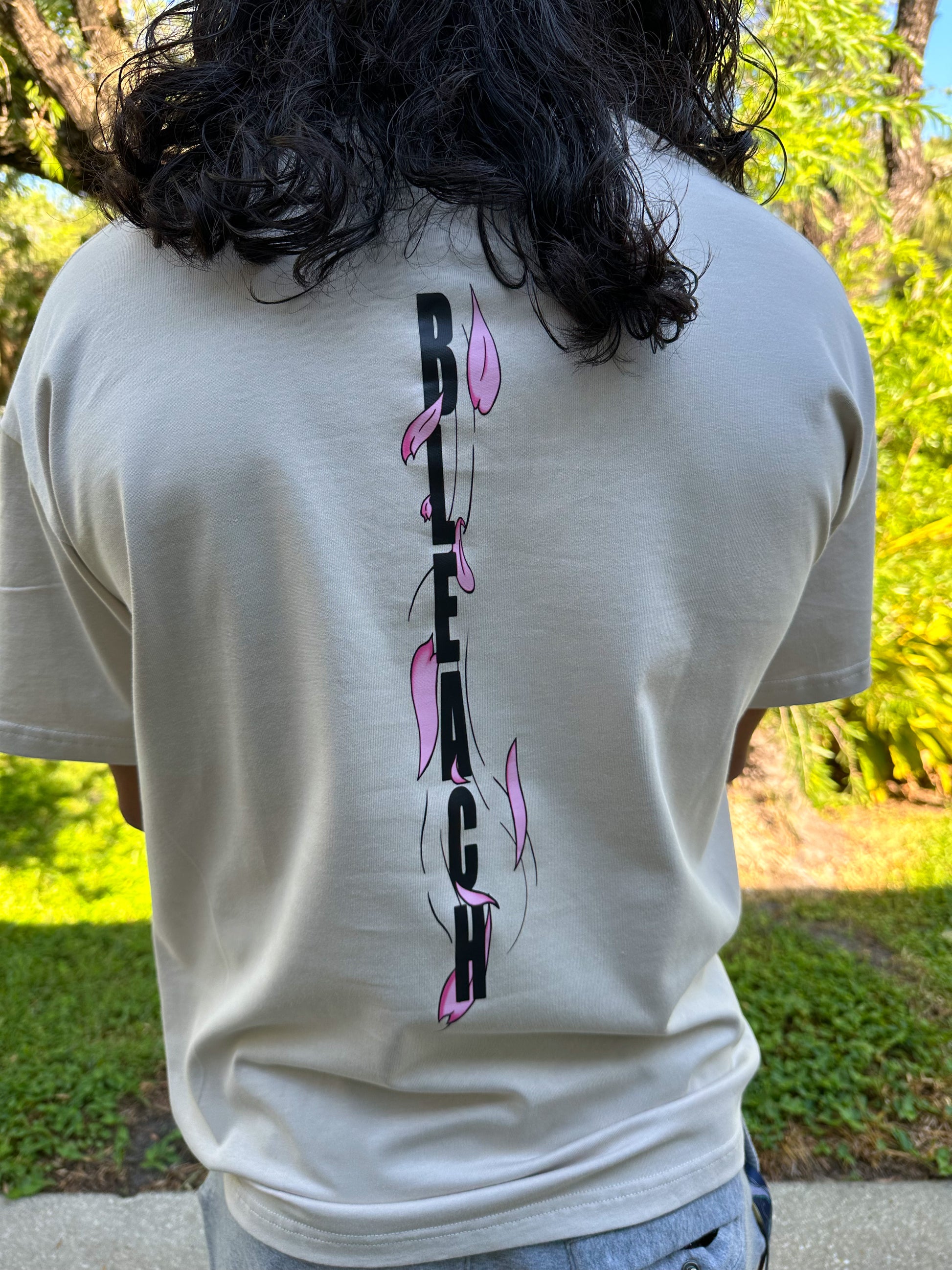 Back on Byakuya tshirt with "BLEACH" written on the back with cherry blossom petals 