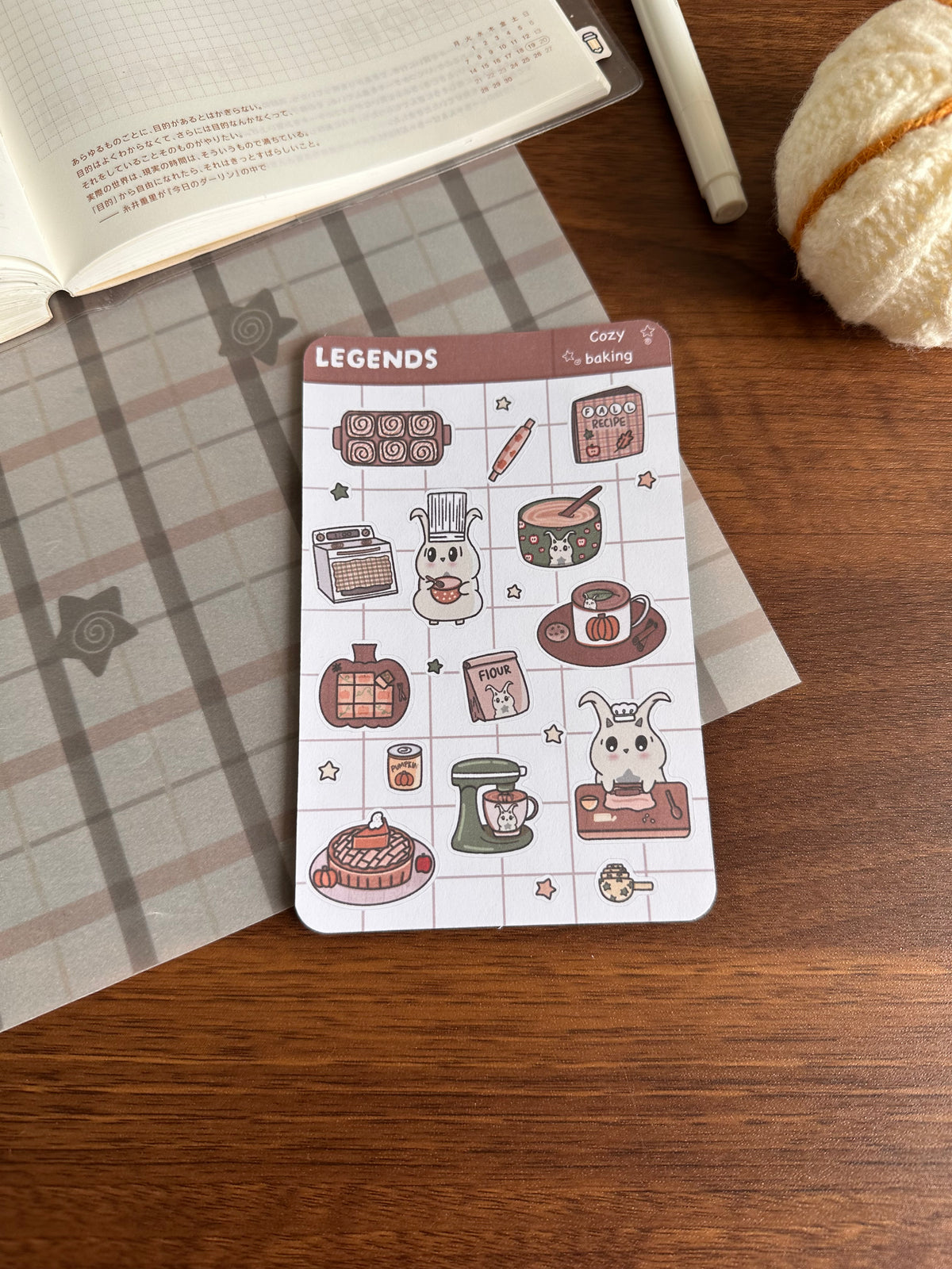 Baking sticker sheet with fall goods on top of a wooden sticker sheet 