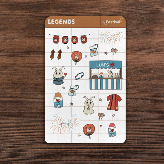 Festival sticker sheet on top of a wooden desk